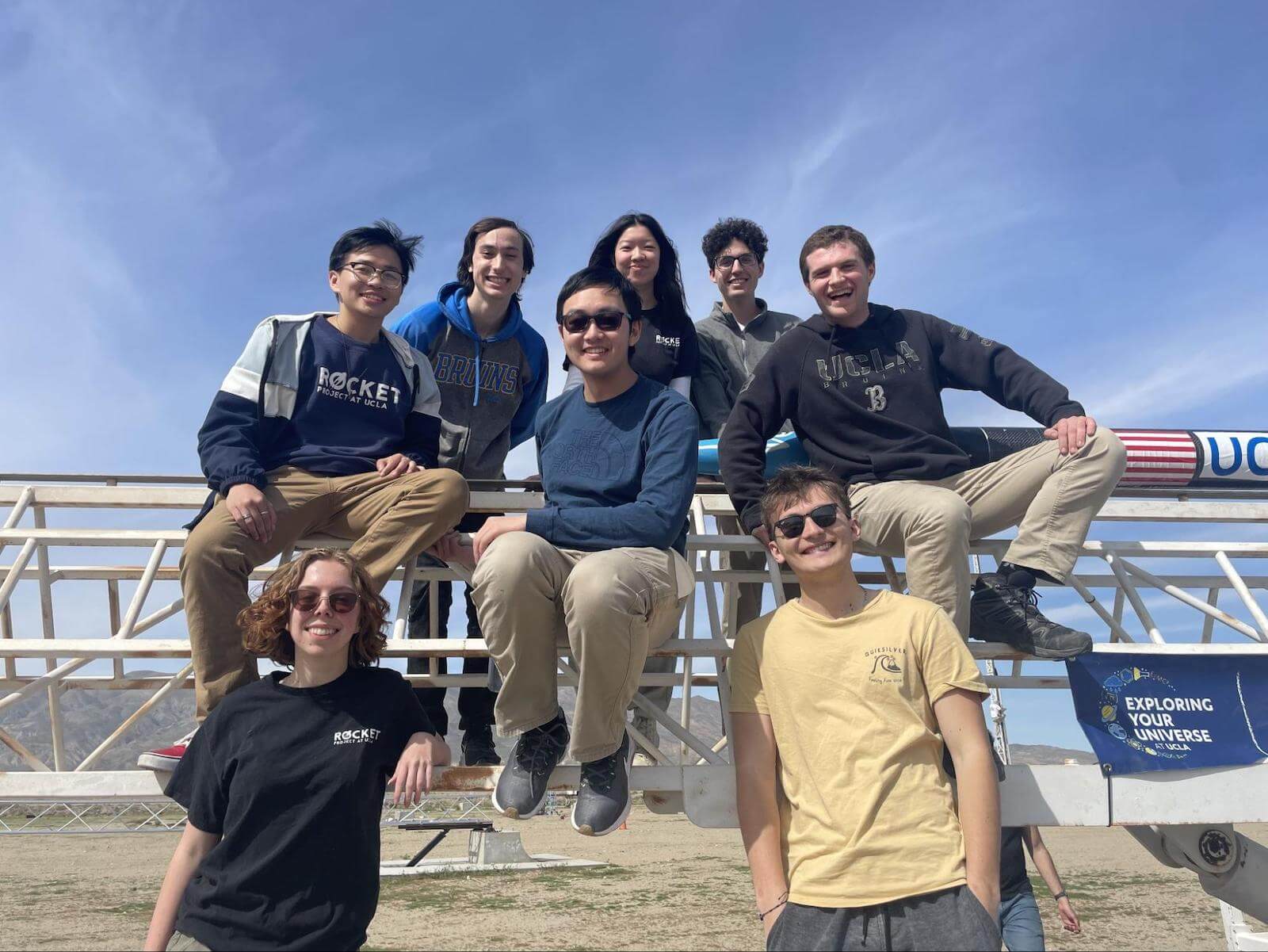 A group of people from the Project Ares Electronics Subteam posing in the desert